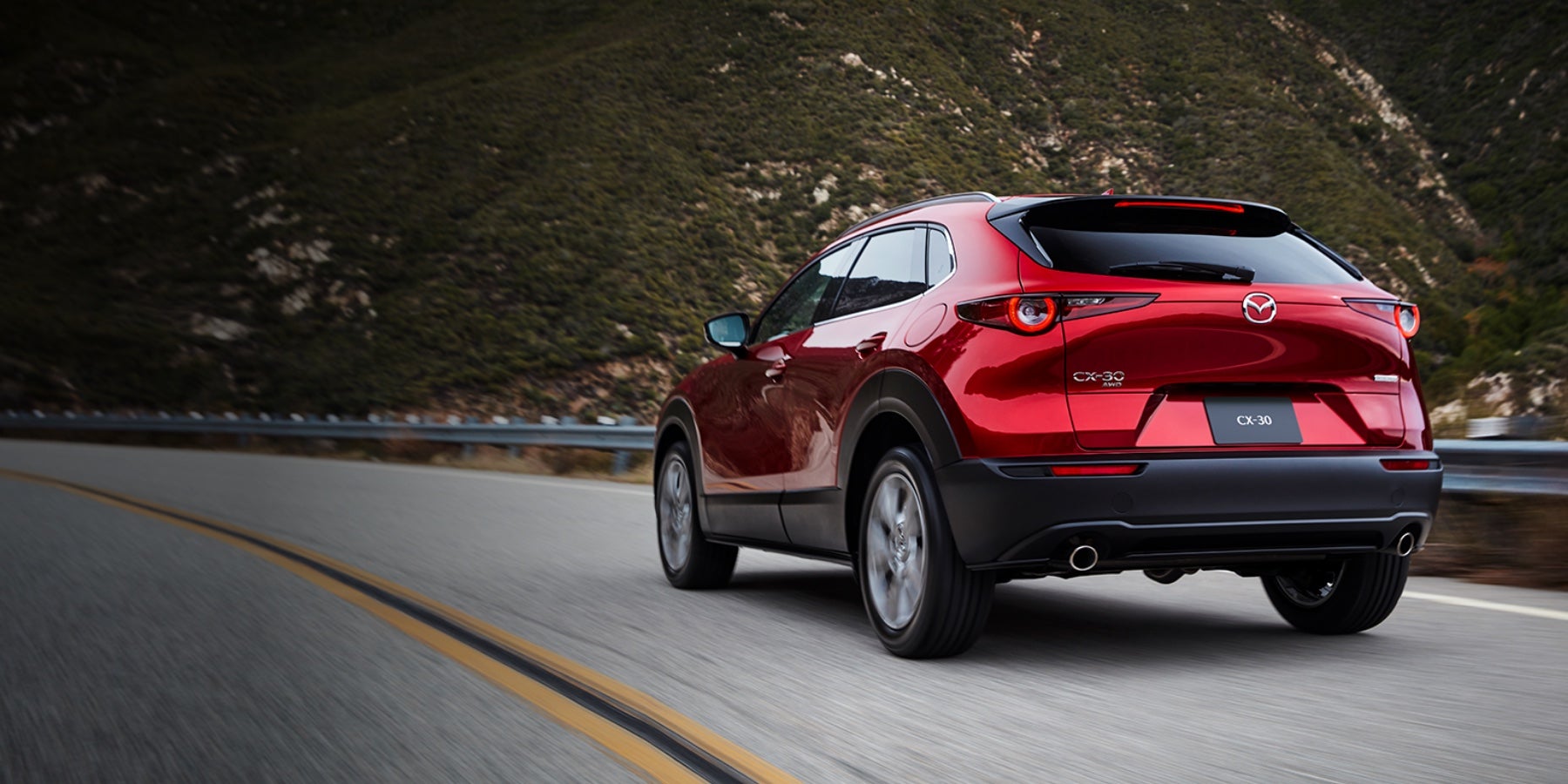 Red 2020 Mazda CX-30 Driving on the road | Russell & Smith Mazda in Houston, TX