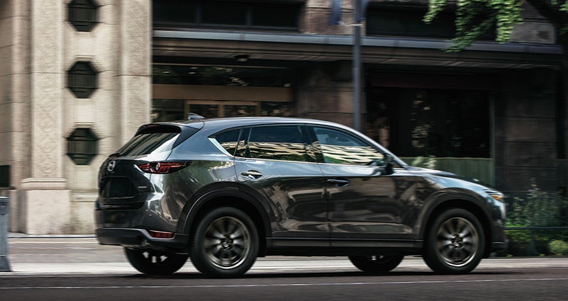 Grey 2020 Mazda CX-5 Driving on the road | Russell & Smith Mazda in Houston, TX