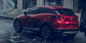 Red 2019 Mazda CX-3 driving in the rain | Mazda Dealer | Houston, TX